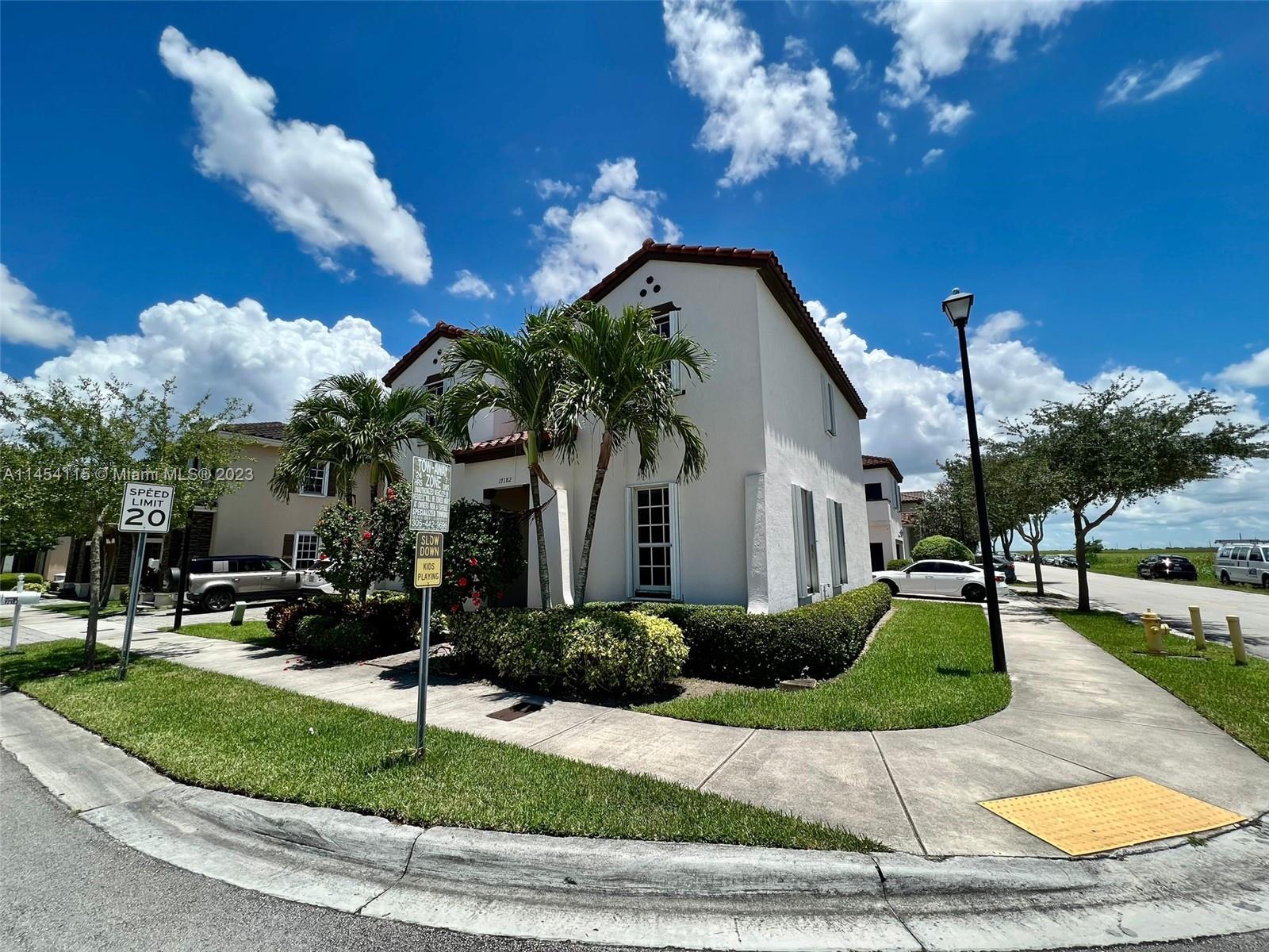 17182 Southwest 92nd Street Miami, FL 33196 - Photo 6 of 46 a front view of a house with garden