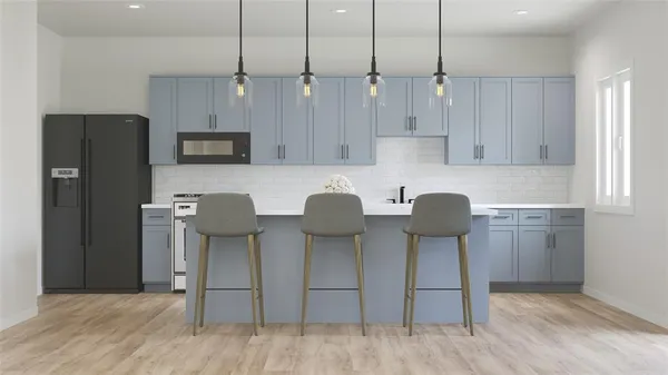 a open kitchen with a sink dishwasher a kitchen island with wooden cabinets and floors