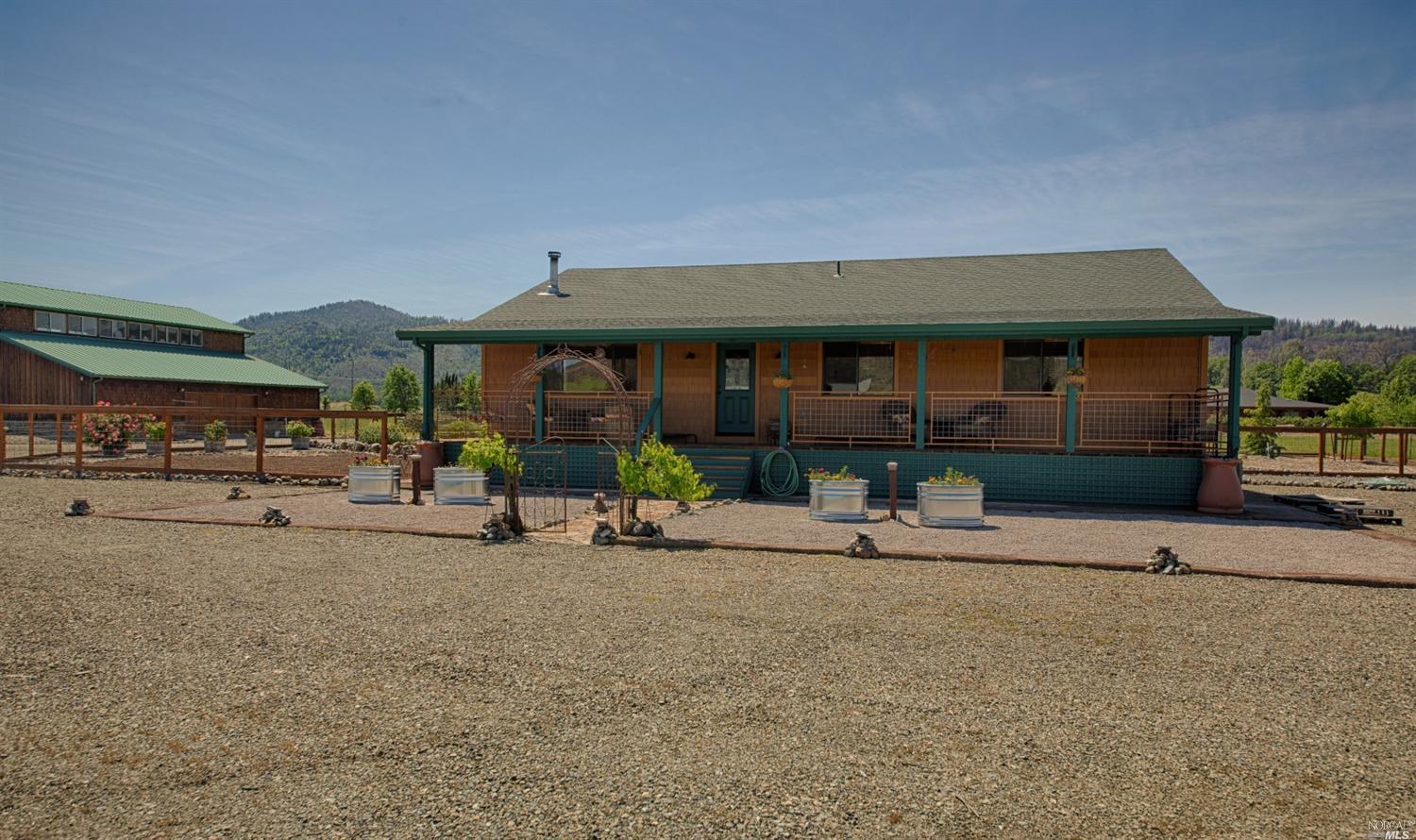 21125 Loconomi Road Middletown, CA 95461 - Photo 1 of 1 front view of a house with a patio