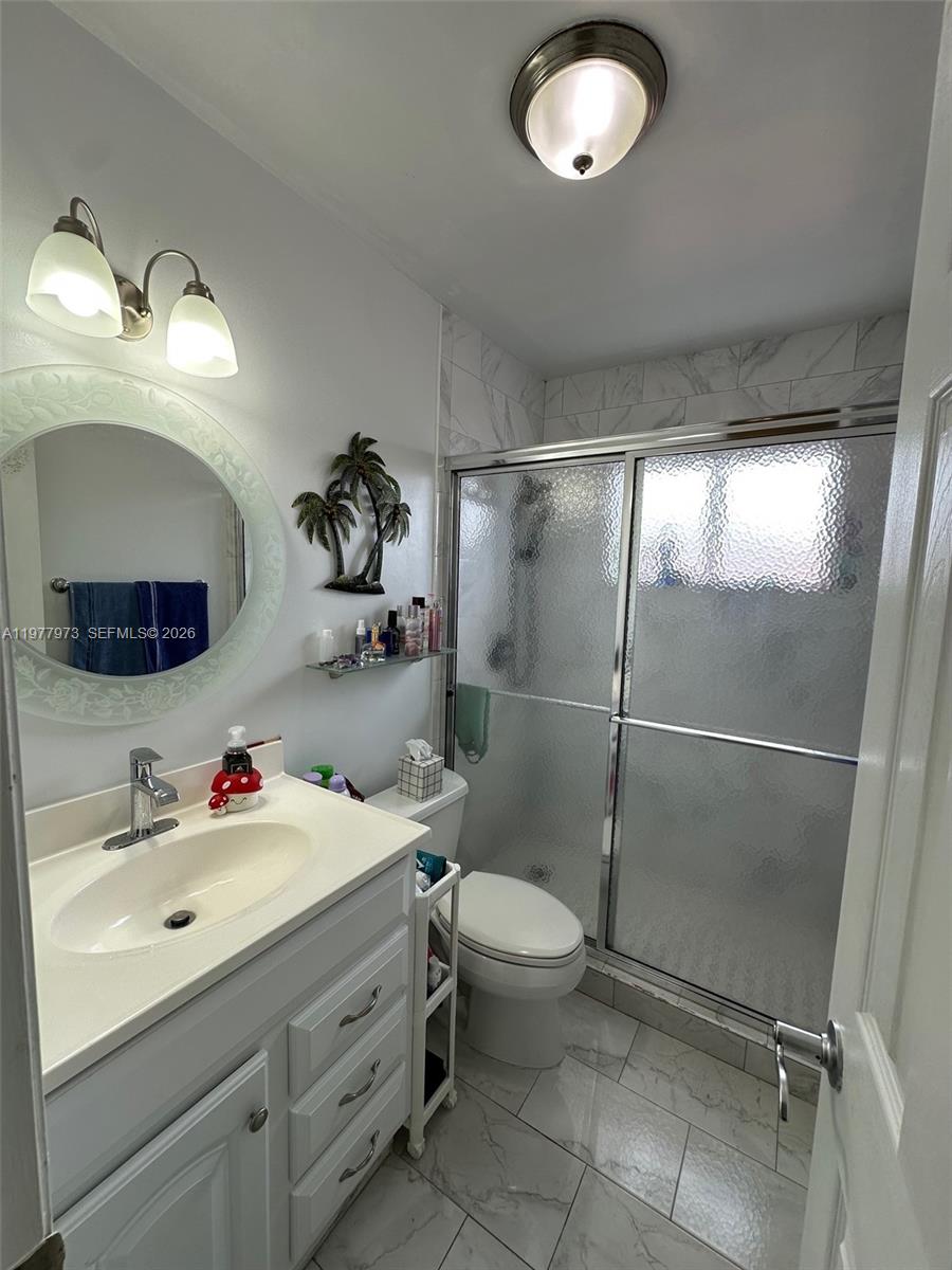 2385 West 69th Street, Unit 2385A Hialeah, FL 33016 - Photo 15 of 22 a bathroom with a sink toilet and shower