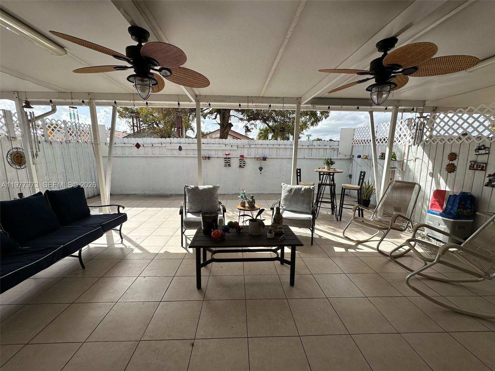 2385 West 69th Street, Unit 2385A Hialeah, FL 33016 - Photo 21 of 22 a outdoor living space with furniture