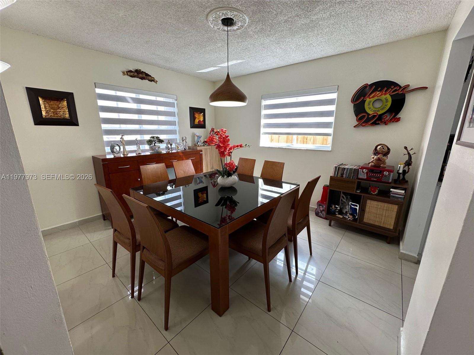 2385 West 69th Street, Unit 2385A Hialeah, FL 33016 - Photo 5 of 22 a dining room with furniture and window