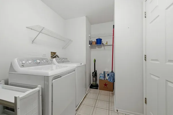 a view of balcony with wooden floor and fence