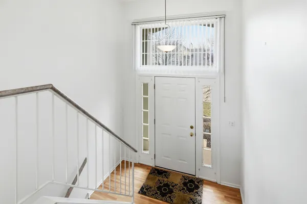 a view of staircase with rug