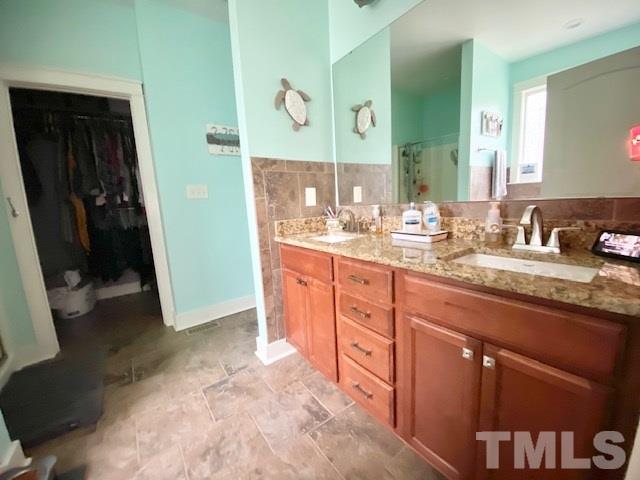 141 American Road Timberlake, NC 27583 - Photo 14 of 27 a bathroom with a sink and a mirror