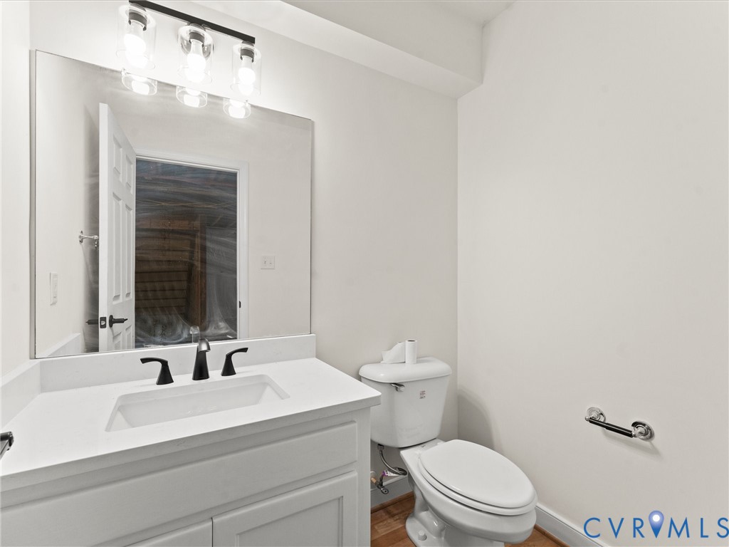 12 Henderson Road New Canton, VA 23123 - Photo 36 of 49 White vanity with recessed panel cabinetry, integr
