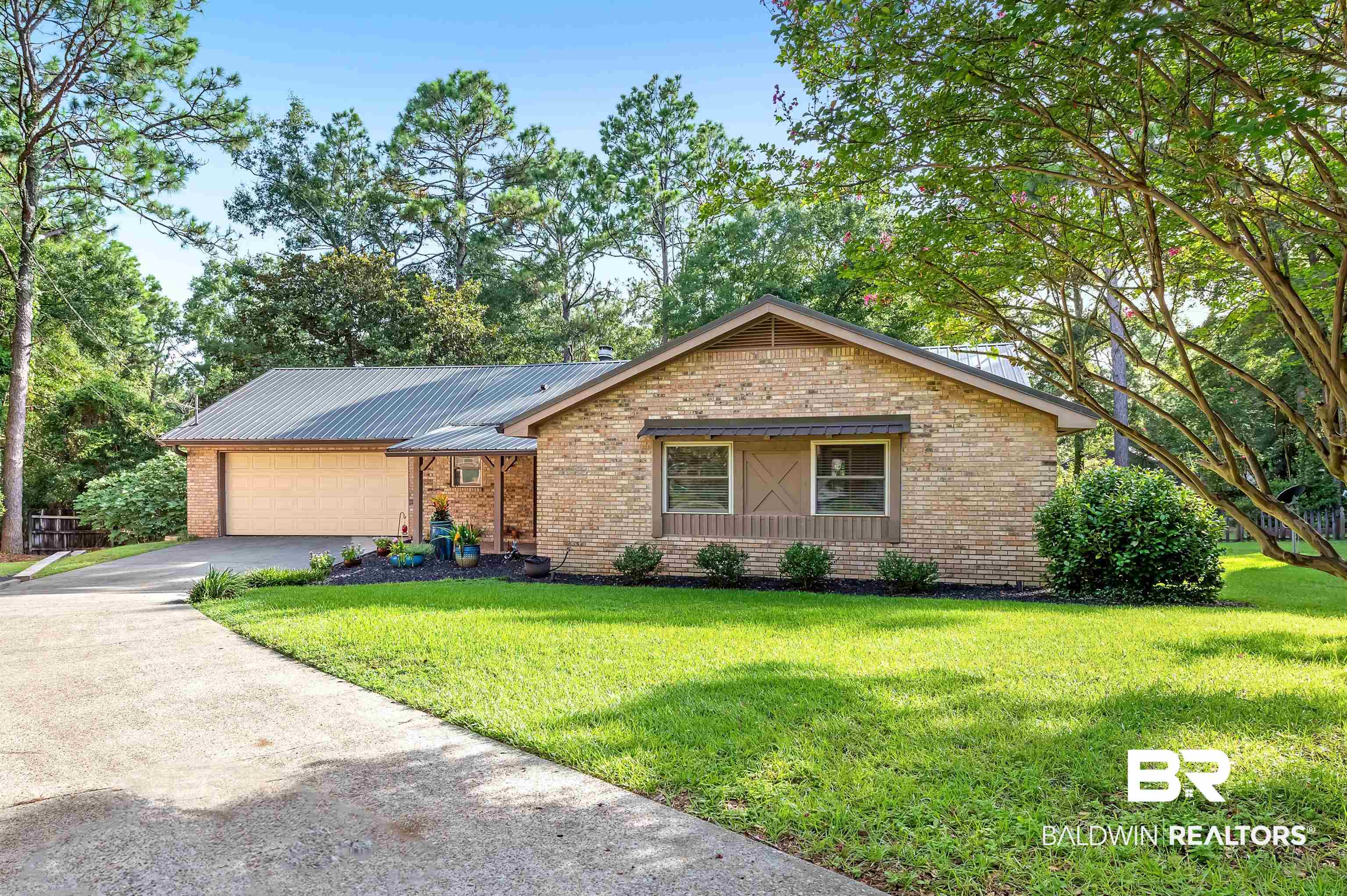 104 James Circle Daphne, AL 36526 - Photo 2 of 62 Ranch-style house featuring a garage and a front yard