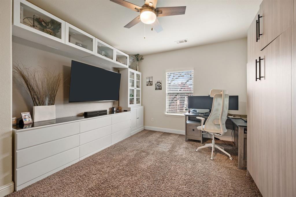 448 Rock Springs Road Coppell, TX 75019 - Photo 17 of 40 a living room with furniture and a flat screen tv