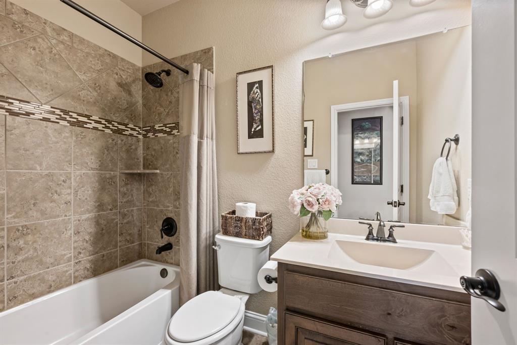448 Rock Springs Road Coppell, TX 75019 - Photo 18 of 40 a bathroom with a sink toilet and shower