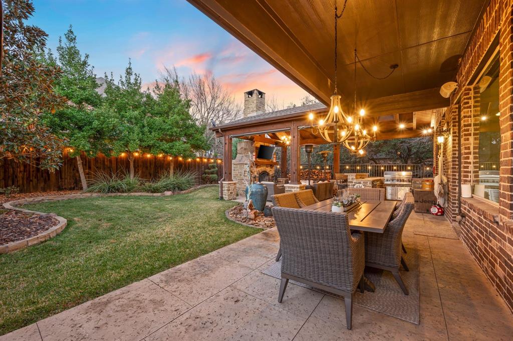 448 Rock Springs Road Coppell, TX 75019 - Photo 24 of 40 a view of a patio with table and chairs and potted plants