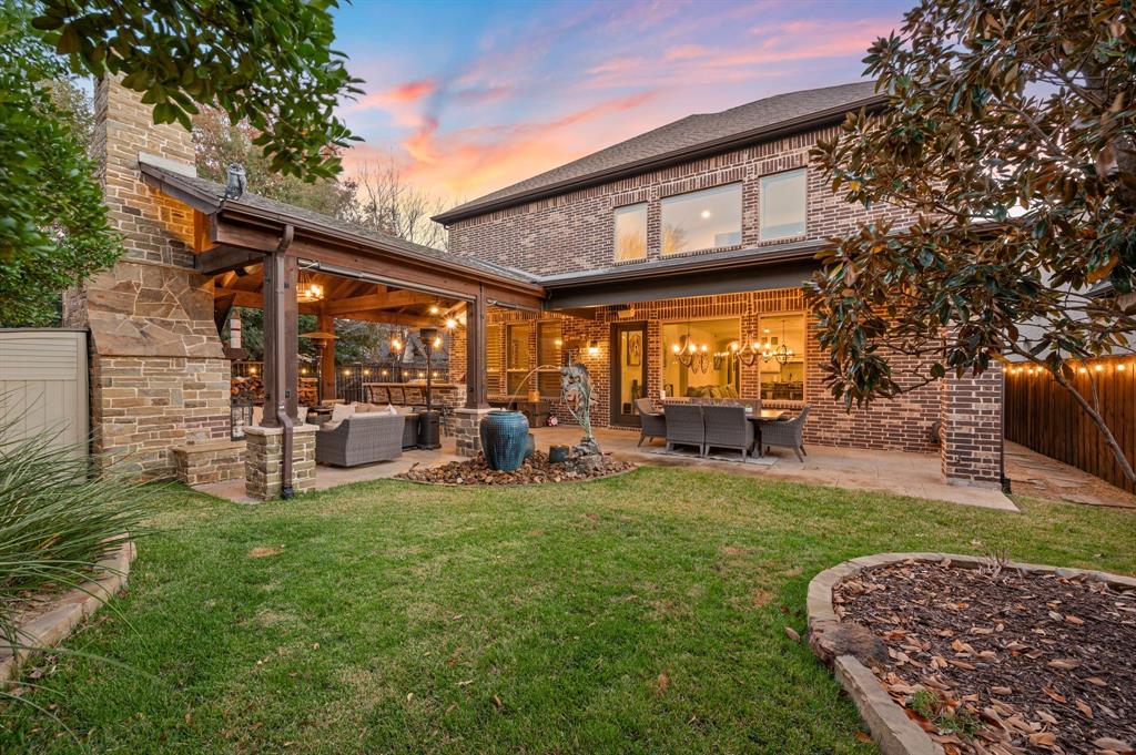 448 Rock Springs Road Coppell, TX 75019 - Photo 28 of 40 a view of a chair and table in backyard of the house