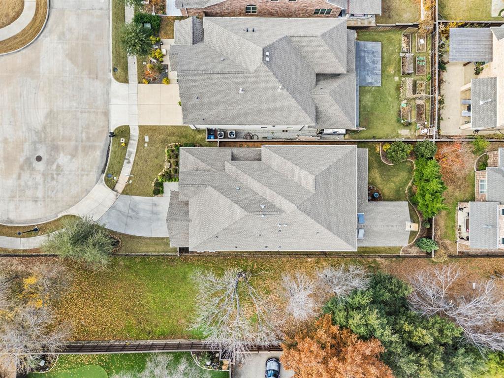 448 Rock Springs Road Coppell, TX 75019 - Photo 33 of 40 an aerial view of residential house with pool and yard