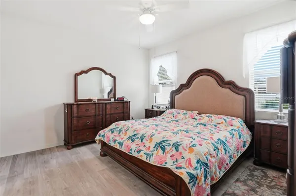 a bedroom with a bed and with mirror