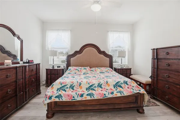 a bedroom with a bed and a mirror