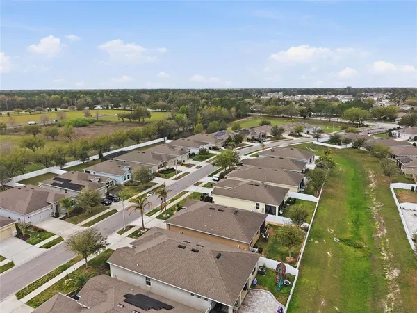 an aerial view of a house with outdoor space
