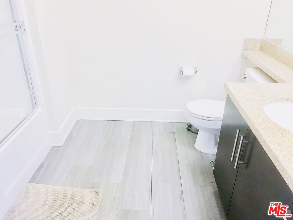 1241 5th Street, Unit 502 Santa Monica, CA 90401 - Photo 18 of 33 a bathroom with a sink and a toilet