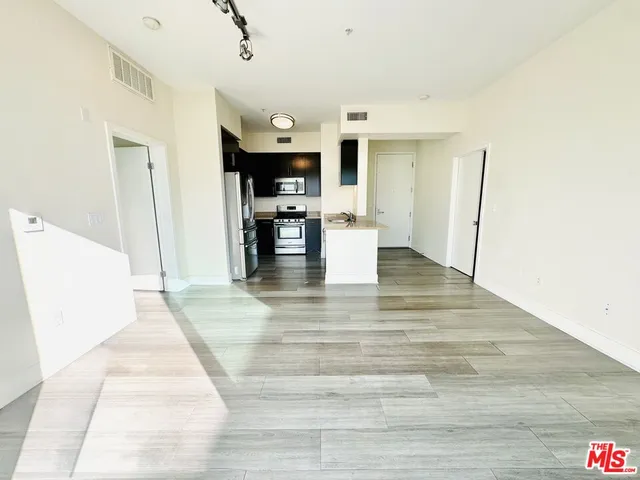 a view of kitchen with furniture and window