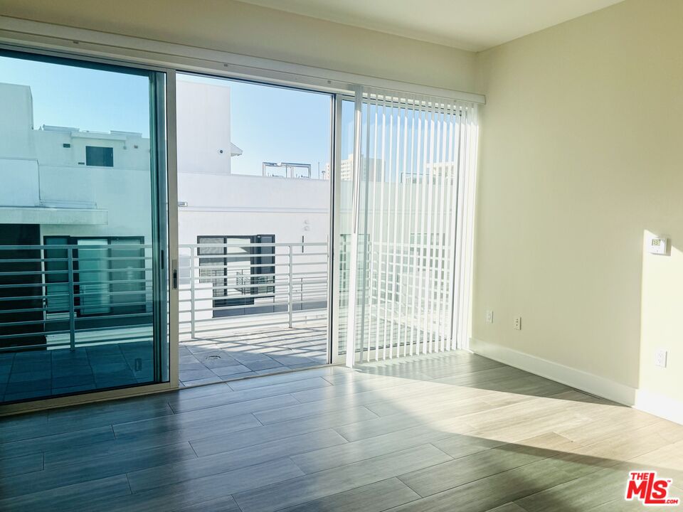 1241 5th Street, Unit 502 Santa Monica, CA 90401 - Photo 7 of 33 a view of a room with wooden floor