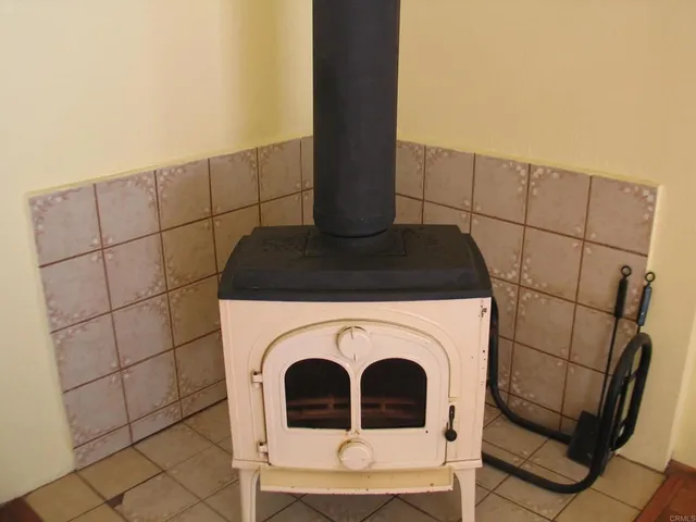 a close view of a utility room with dryer and washer