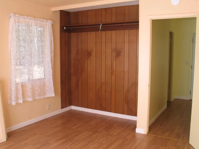 a view of an entryway with wooden floor