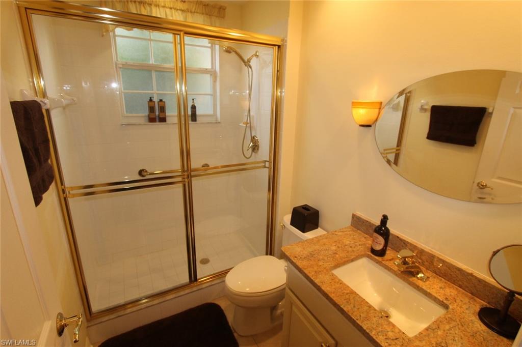 8526 Peppertree Way Naples, FL 34114 - Photo 11 of 14 a bathroom with a sink toilet and shower