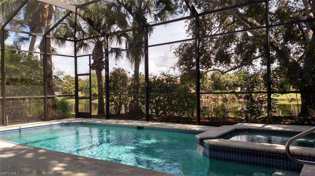 8526 Peppertree Way Naples, FL 34114 - Photo 2 of 14 a view of swimming pool with patio