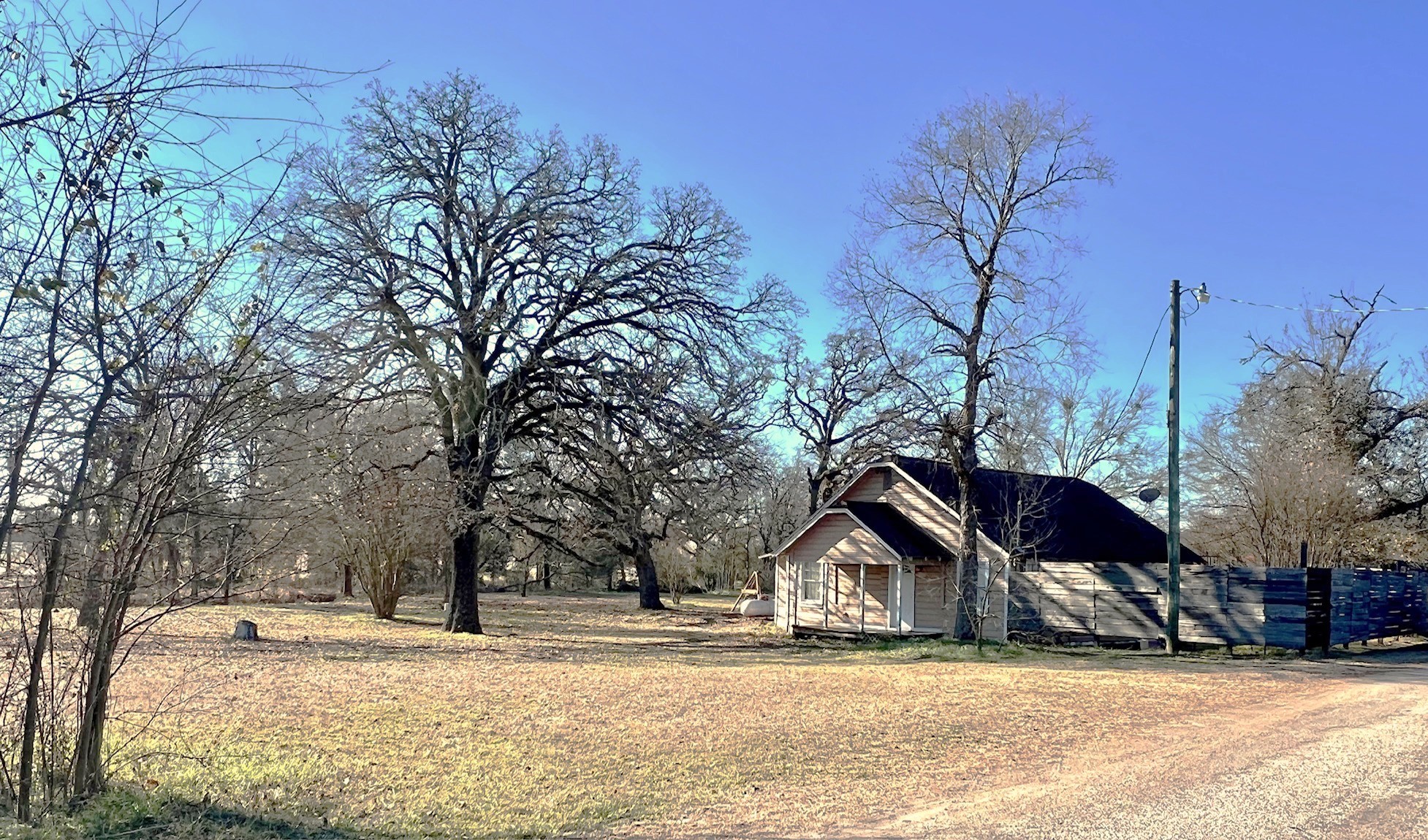 592 Burr Road Madisonville, TX 77864 - Photo 3 of 5 a view of a house with a snow in the yard
