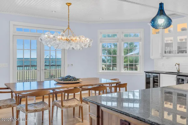a living room with furniture fireplace and a large window