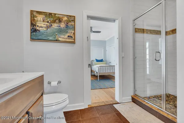 a view of a roof deck with couches and potted plants