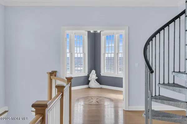 a kitchen with stainless steel appliances kitchen island sink stove and wooden cabinets