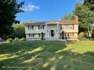 51 Homestead Road Freehold, NJ 07728 - Photo 1 of 20 a front view of a house with a garden