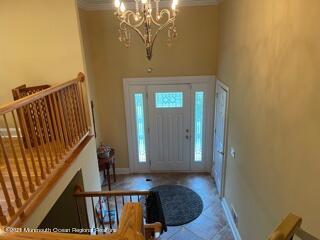 51 Homestead Road Freehold, NJ 07728 - Photo 2 of 20 a view of a hallway with wooden floor and staircase