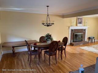 51 Homestead Road Freehold, NJ 07728 - Photo 11 of 20 a dining room with furniture a chandelier and wooden floor