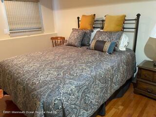 51 Homestead Road Freehold, NJ 07728 - Photo 15 of 20 a bedroom with a bed and wooden floor