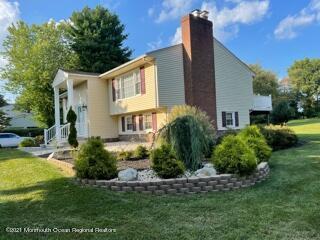 51 Homestead Road Freehold, NJ 07728 - Photo 18 of 20 a front view of a house with garden