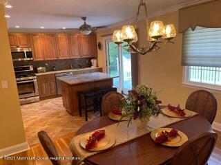 51 Homestead Road Freehold, NJ 07728 - Photo 3 of 20 a kitchen with furniture and a fireplace