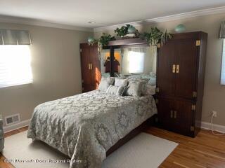 51 Homestead Road Freehold, NJ 07728 - Photo 6 of 20 a bedroom with a bed and a mirror