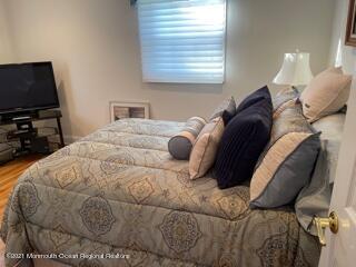 51 Homestead Road Freehold, NJ 07728 - Photo 7 of 20 a bed sitting in a bedroom next to a window