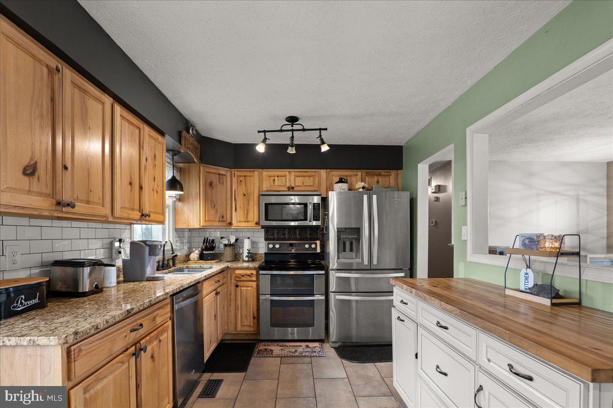 45 Greenleaf Road Strasburg, VA 22657 - Photo 13 of 30 Charming kitchen with rustic elegance.