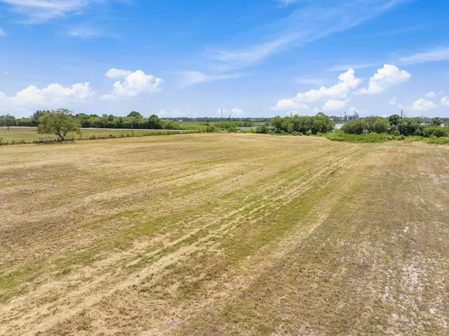 a view of a lake with houses in the background