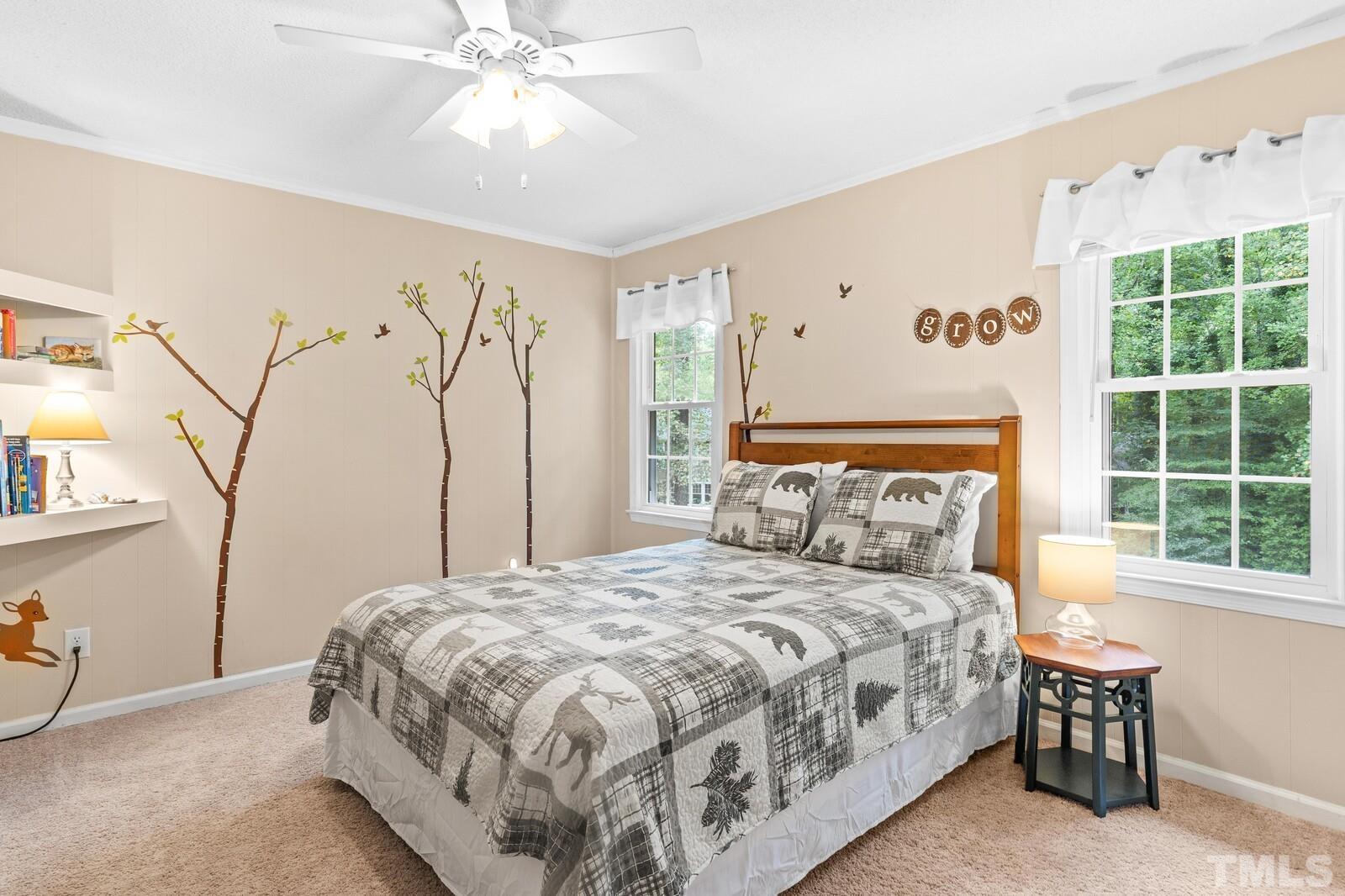 8312 Heel Stone Court Raleigh, NC 27613 - Photo 19 of 30 a bedroom with a large bed and a window