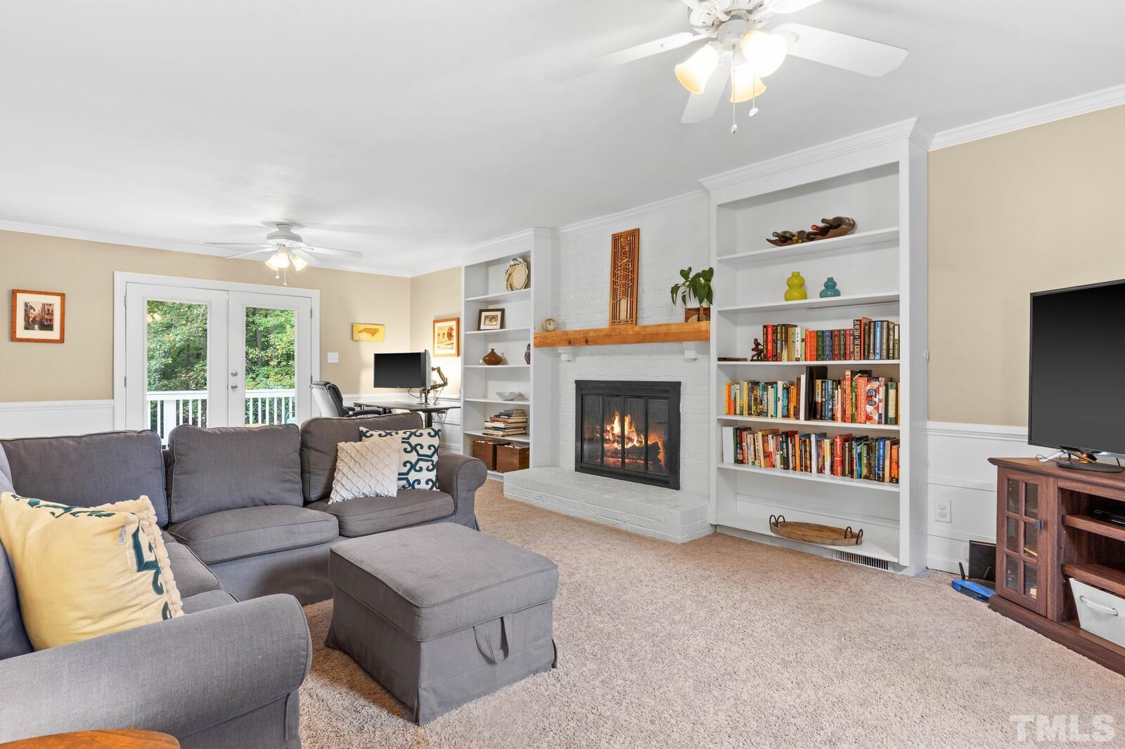 8312 Heel Stone Court Raleigh, NC 27613 - Photo 3 of 30 a living room with furniture and a fireplace