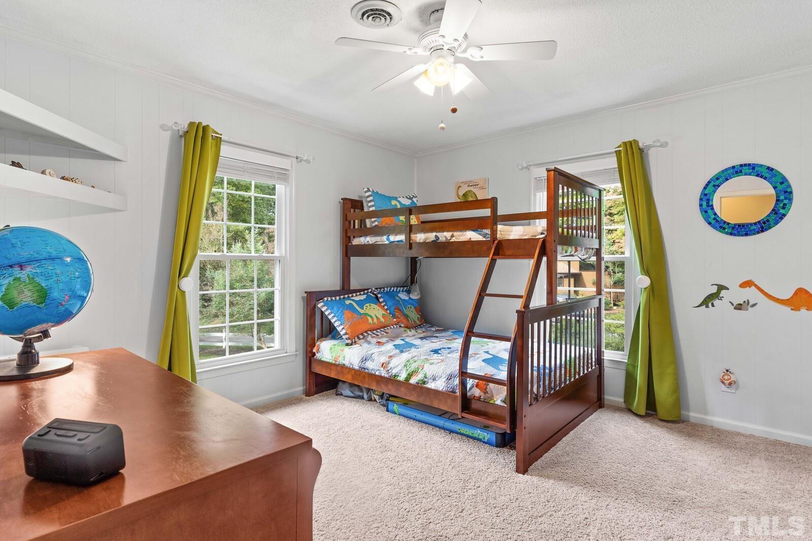 8312 Heel Stone Court Raleigh, NC 27613 - Photo 21 of 30 a bedroom with furniture and a large window