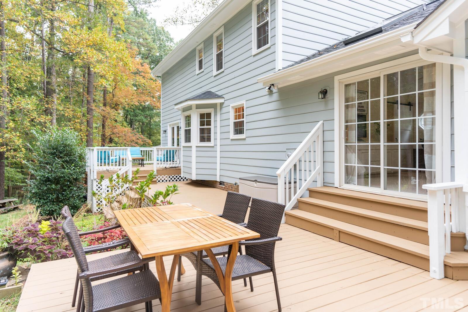 8312 Heel Stone Court Raleigh, NC 27613 - Photo 23 of 30 a balcony with table and chairs