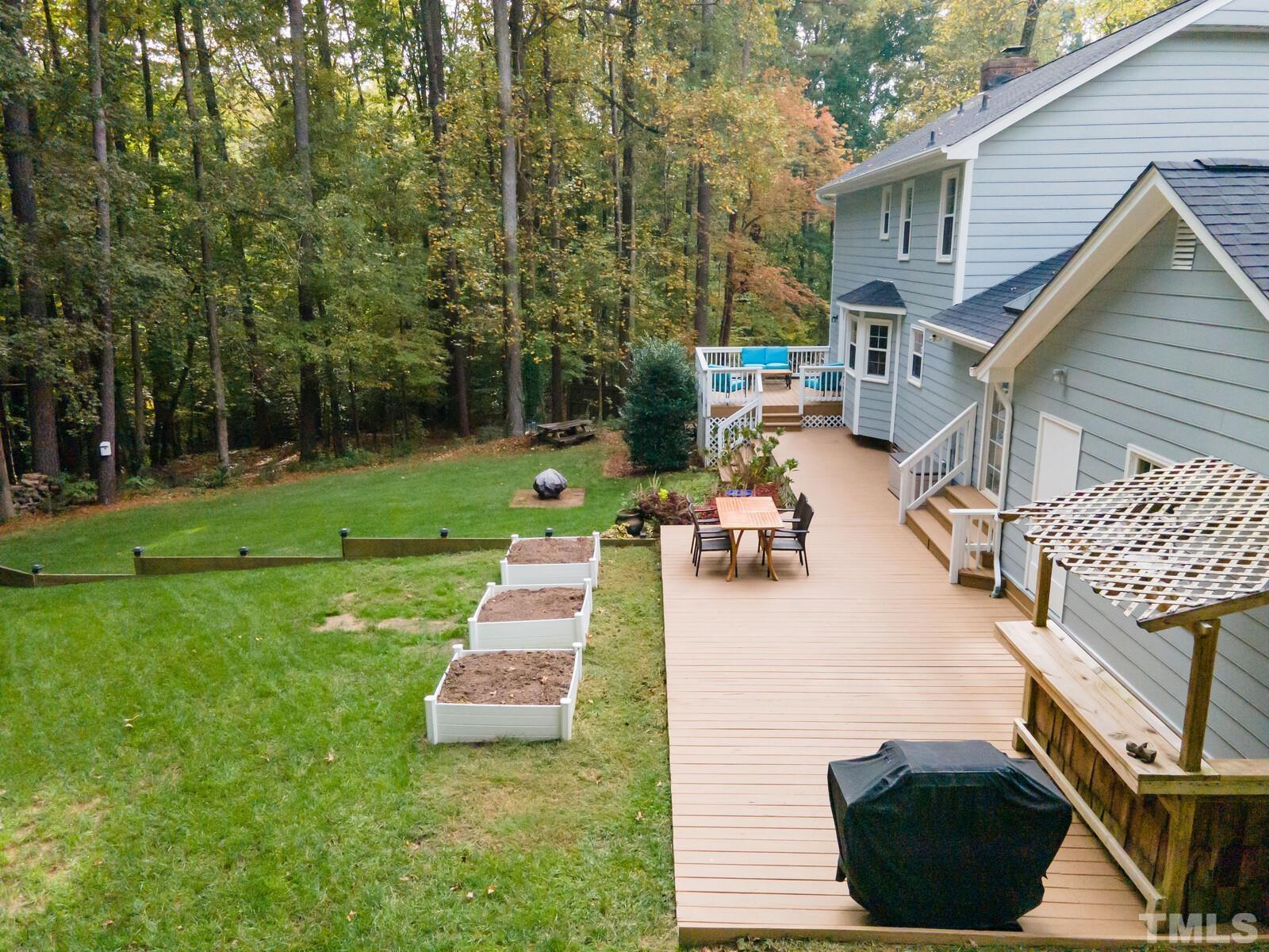 8312 Heel Stone Court Raleigh, NC 27613 - Photo 26 of 30 a view of a backyard with sitting area