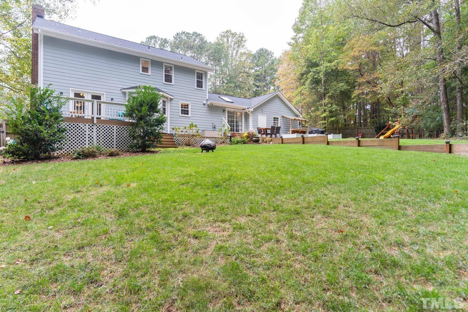 8312 Heel Stone Court Raleigh, NC 27613 - Photo 27 of 30 a front view of house with yard and green space