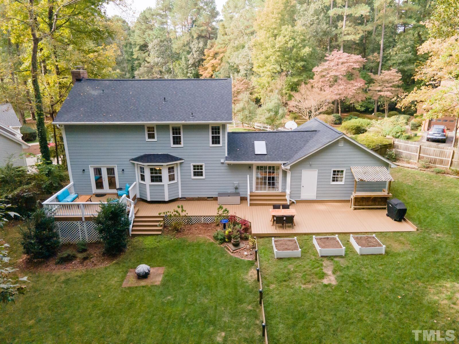 8312 Heel Stone Court Raleigh, NC 27613 - Photo 28 of 30 a front view of house with yard and trees in the background