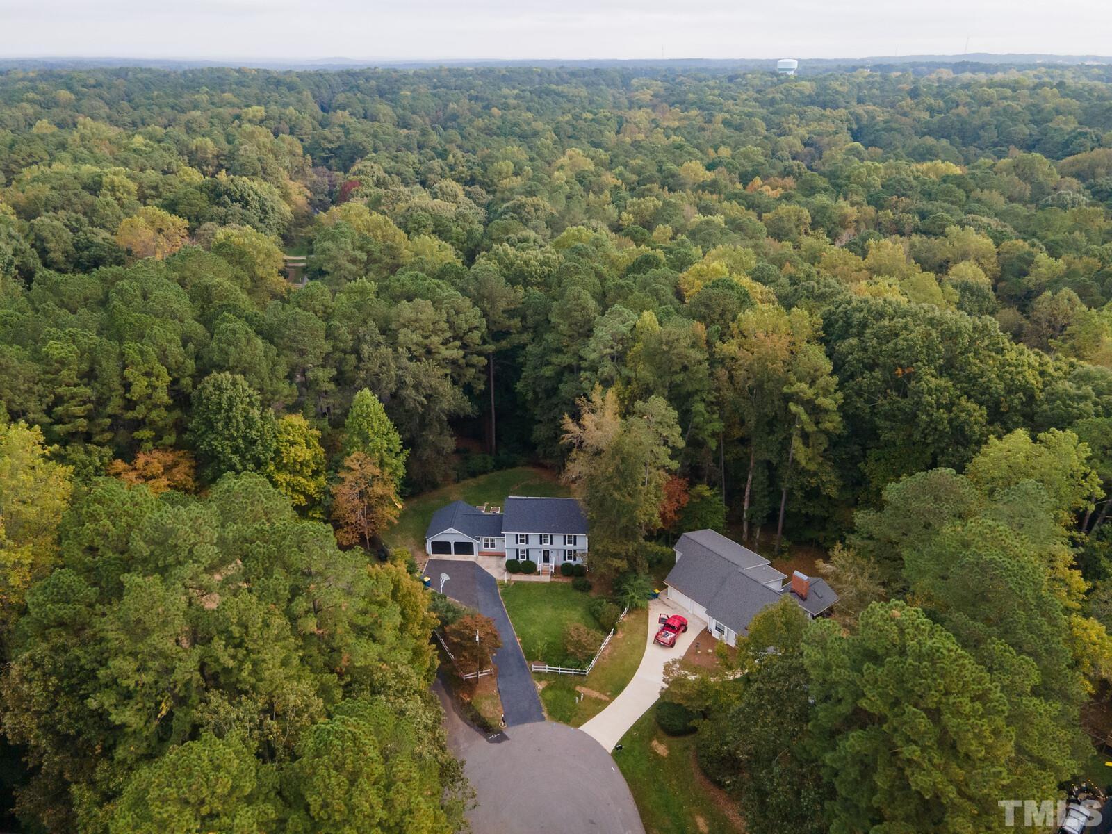 8312 Heel Stone Court Raleigh, NC 27613 - Photo 30 of 30 an aerial view of a house with a yard and lake view