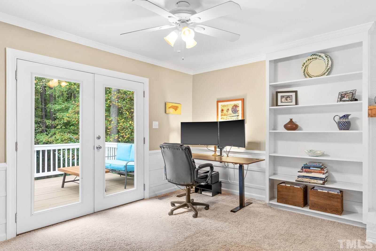 8312 Heel Stone Court Raleigh, NC 27613 - Photo 6 of 30 a view of a workspace with furniture and a window