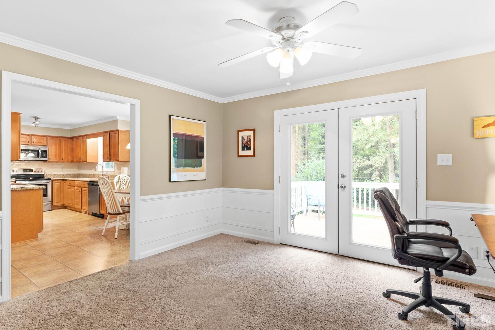 8312 Heel Stone Court Raleigh, NC 27613 - Photo 7 of 30 a view of a livingroom with workspace and a window